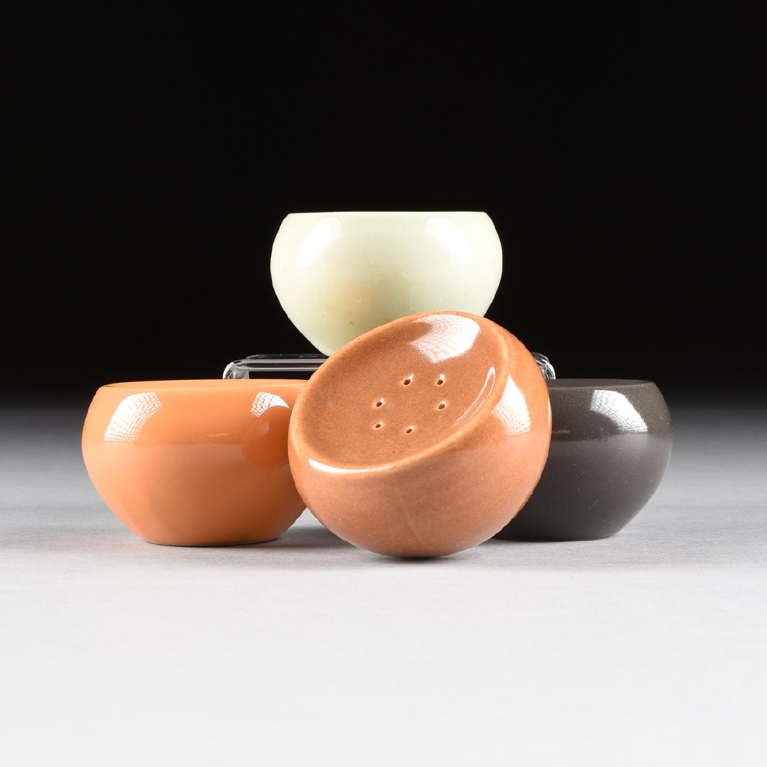 A GROUP OF FOUR RUSSEL WRIGHT (American, 1904-1976): A GROUP OF FOUR RUSSEL WRIGHT (American, 1904-1976) "CASUAL CHINA" STACKING SALT SHAKERS, FOR IROQUOIS CHINA CO., SYRACUSE, NEW YORK, DESIGNED 1947, comprising one each in Lettuce, Charcoal, Ripe Apri