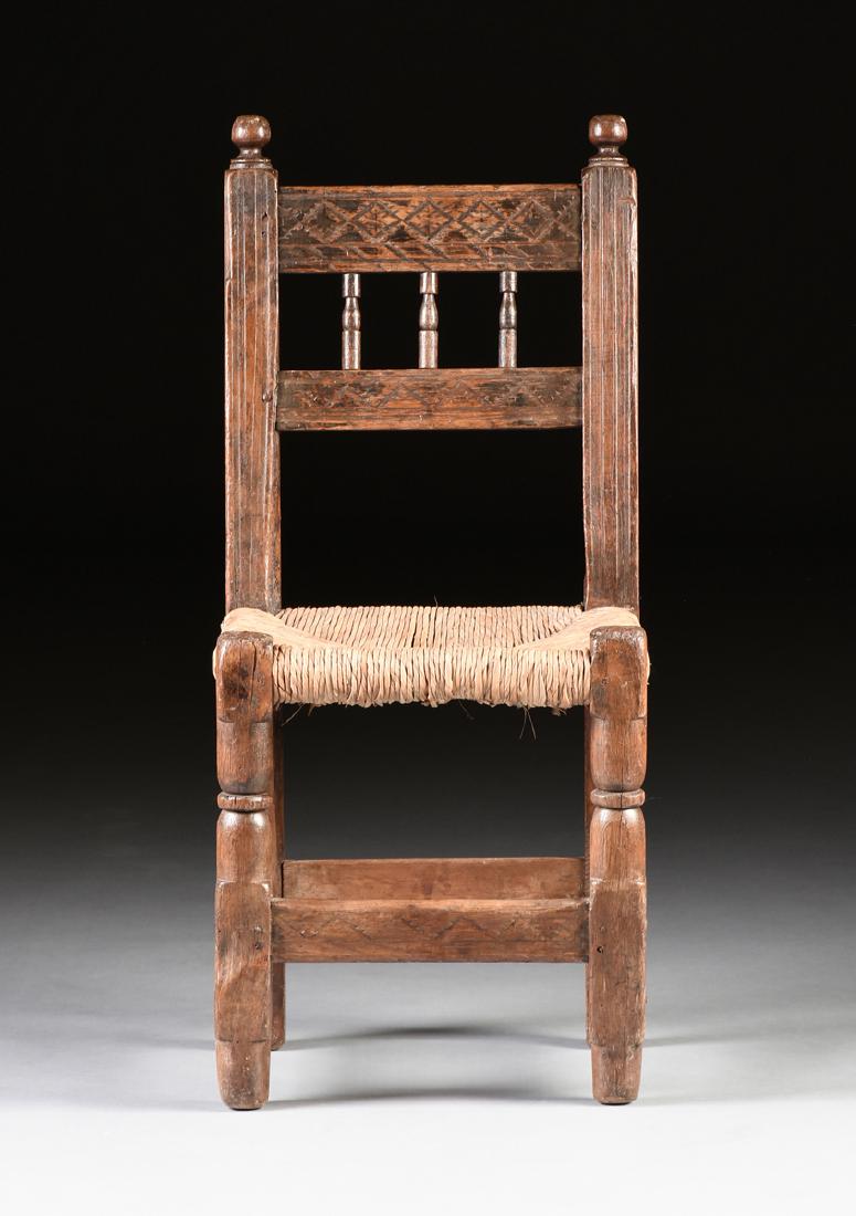 A PRIMITIVE CARVED AND PAINTED TURNED PINE CHAIR, (1 of 12)