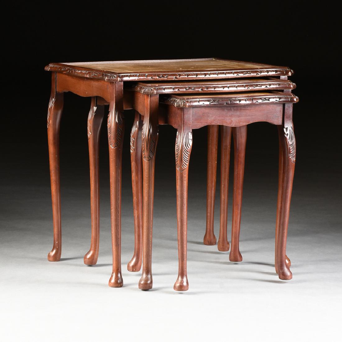 A NEST OF THREE CHIPPENDALE STYLE LEATHER TOP TABLES, (1 of 10)