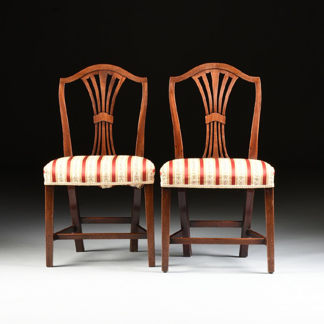 A PAIR OF HEPPLEWHITE STYLE MAHOGANY DINING CHAIRS,: A PAIR OF HEPPLEWHITE STYLE MAHOGANY DINING CHAIRS, PROBABLY ENGLISH, LAST HALF 19TH CENTURY, the arched crest rails over a pierced tapered vasiform vertical splats, above square seats, now in striped