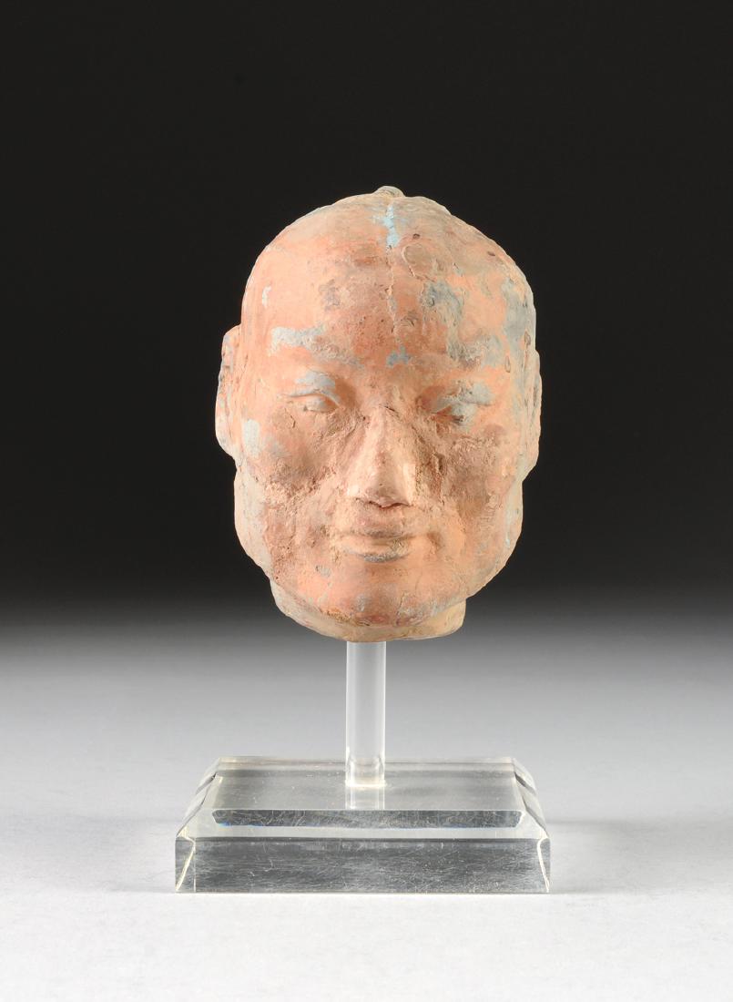 A SINO-JAPANESE EARTHENWARE HEAD, (1 of 5)