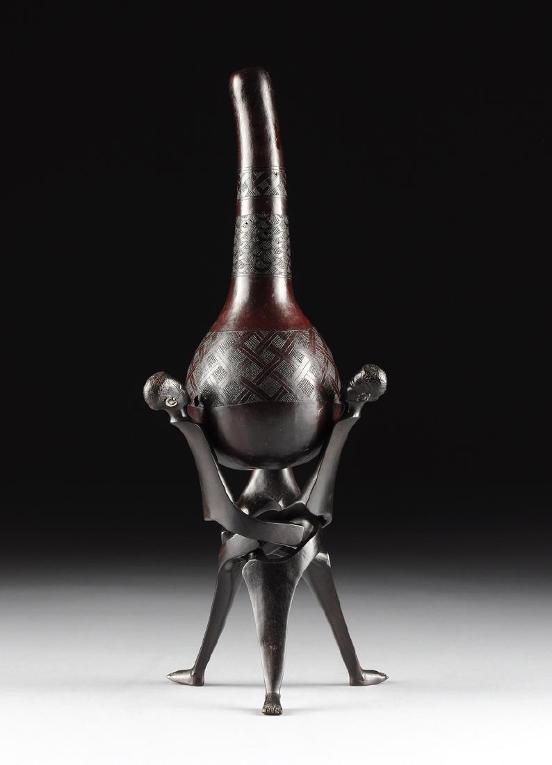 AN AFRICAN TRIBAL INCISED GOURD FORM MUSICAL INSTRUMENT (1 of 10)