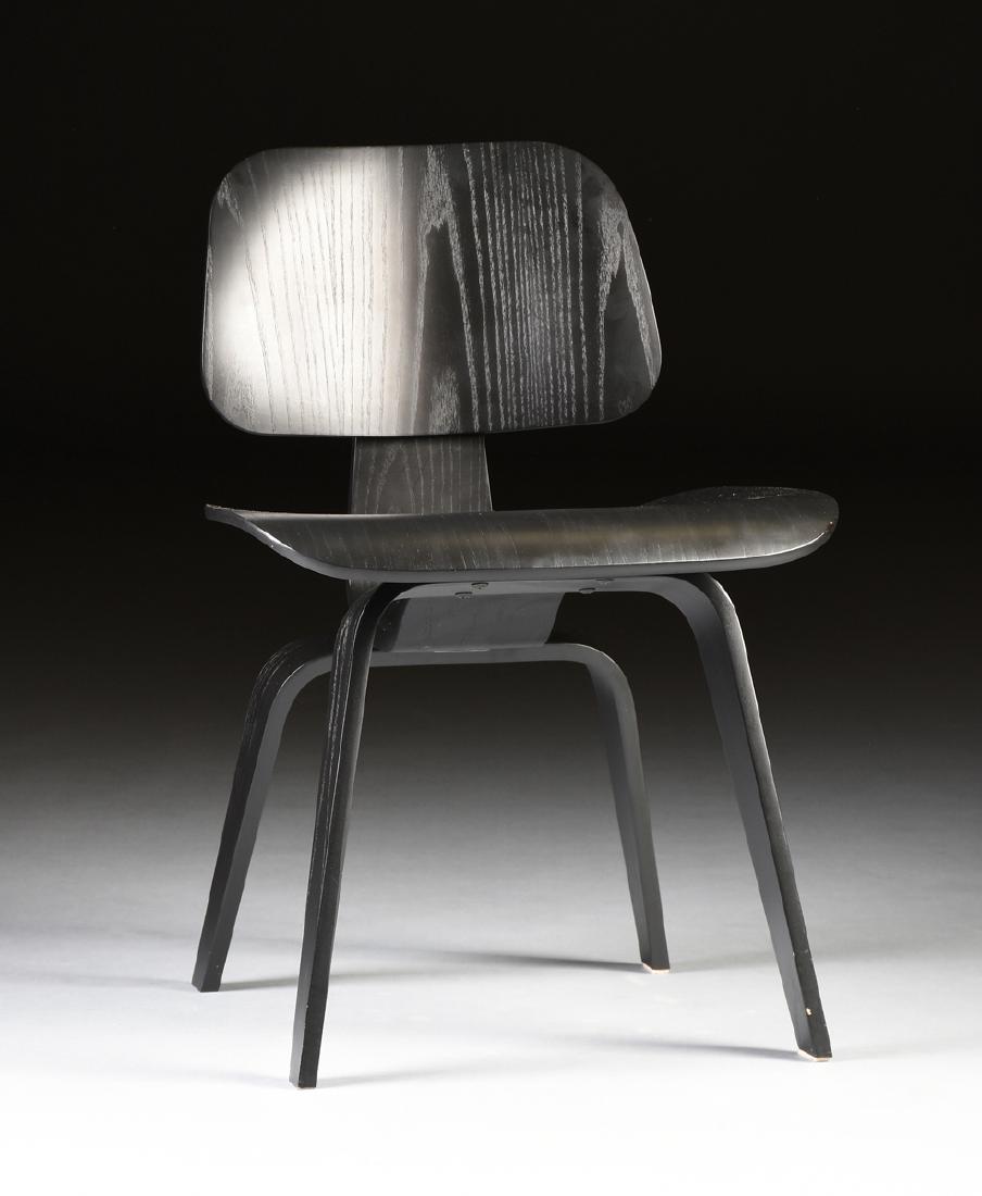 CHARLES EAMES (American 1907-1978) AND RAY EAMES: CHARLES EAMES (American 1907-1978) AND RAY EAMES (American 1912-1988) A MOLDED STAINED ASH "DCW" LOUNGE CHAIR, FOR HERMAN MILLER, ZEELAND, MICHIGAN, DESIGNED 1946, THIS EXAMPLE 2002, of molded ebony s
