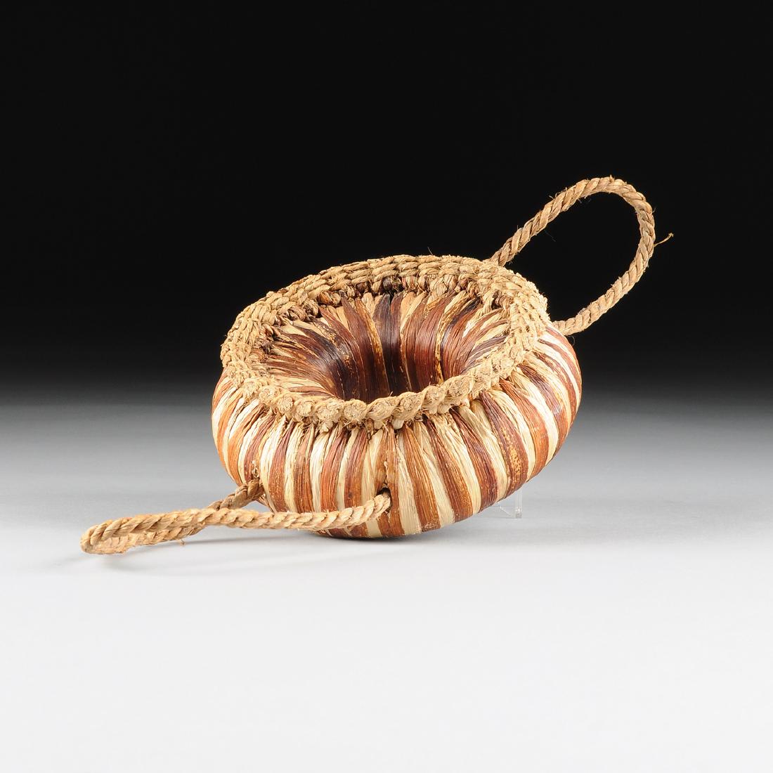 A TRIBAL WOVEN RAFFIA AND HEMP CIRCULAR CARRYING (1 of 6)