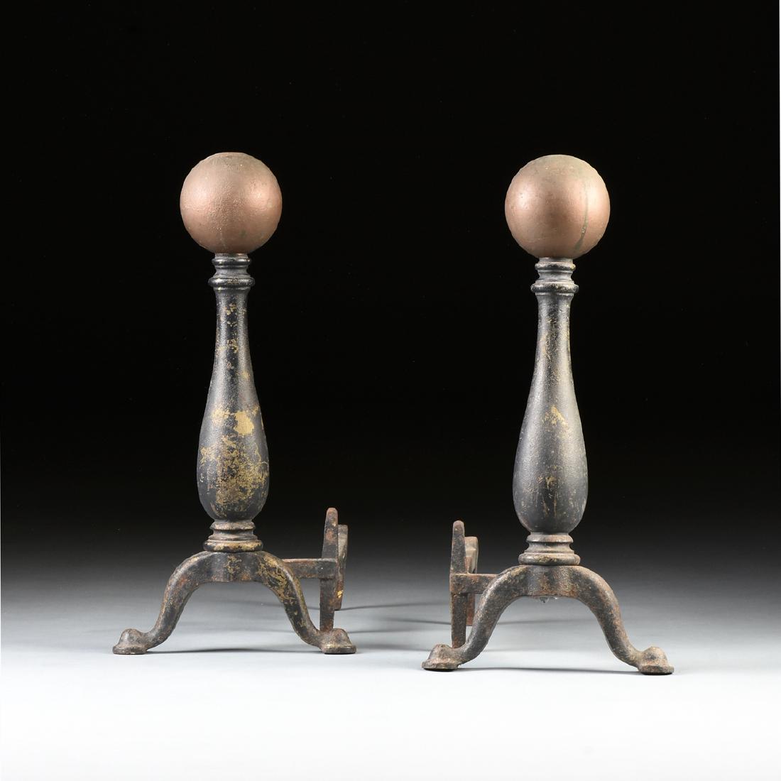 A PAIR OF BRADLEY & HUBBARD MANUFACTURING CO.: A PAIR OF BRADLEY & HUBBARD MANUFACTURING CO. (1852-1940) PARCEL GILT CAST IRON ANDIRONS, 1875 AND LATER, the large canon ball finials over tapered baluster supports to ringed socles, on two cabriole 