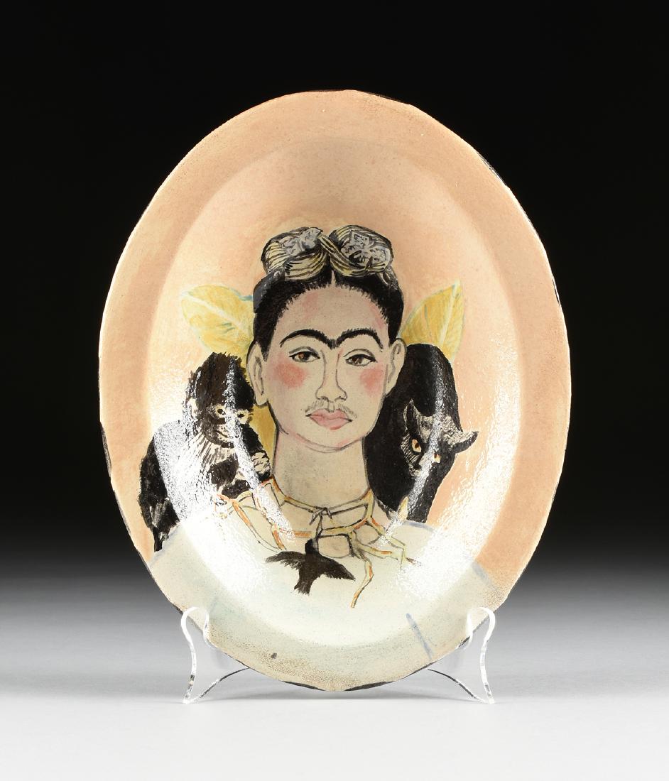 after FRIDA KHALO (Mexican 1907-1954) A TALAVERA: after FRIDA KHALO (Mexican 1907-1954) A TALAVERA PLATTER, "Self Portrait with Thorn Necklace and Hummingbird," signed "Sharon," the flat oval rim centering a dished interior painted with a peach groun