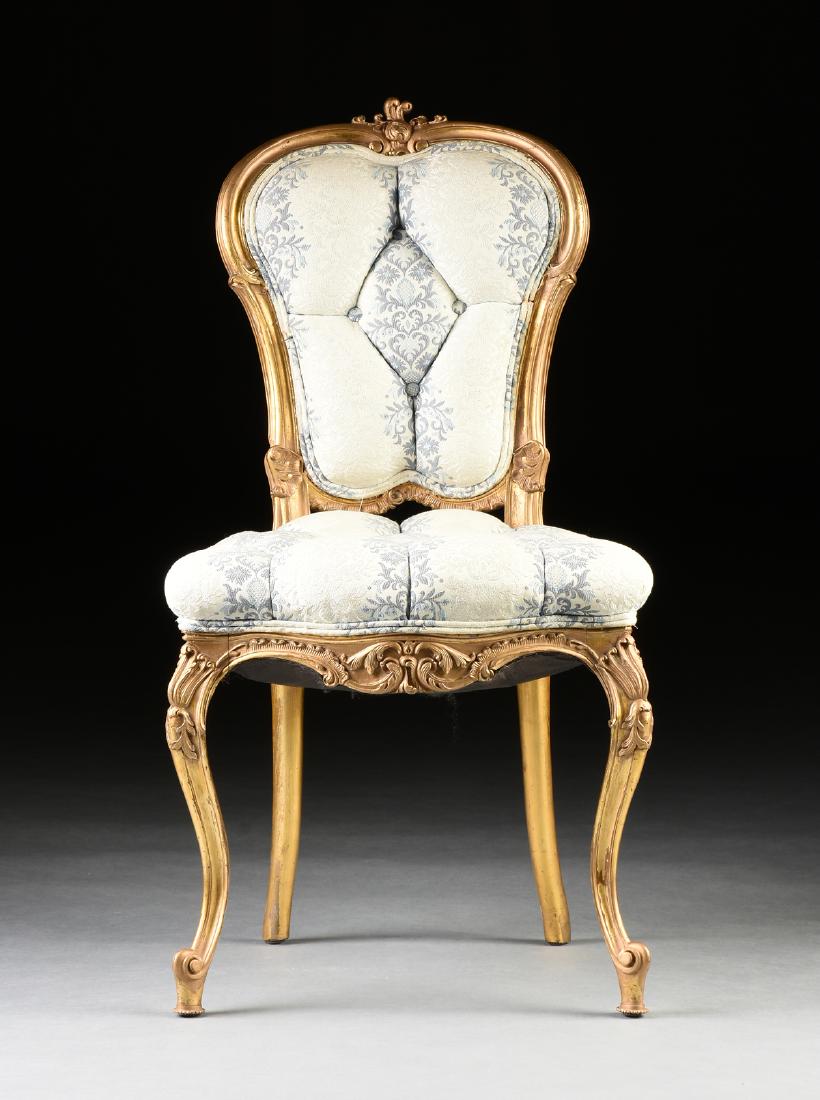 AN ITALIAN ROCOCO REVIVAL GILTWOOD CHAIR, 19TH CENTURY,: AN ITALIAN ROCOCO REVIVAL GILTWOOD CHAIR, 19TH CENTURY, in the Louis XV taste, the double arched back centering a foliate flourish, over a button tufted, shield form back, with carved shell fan and ru