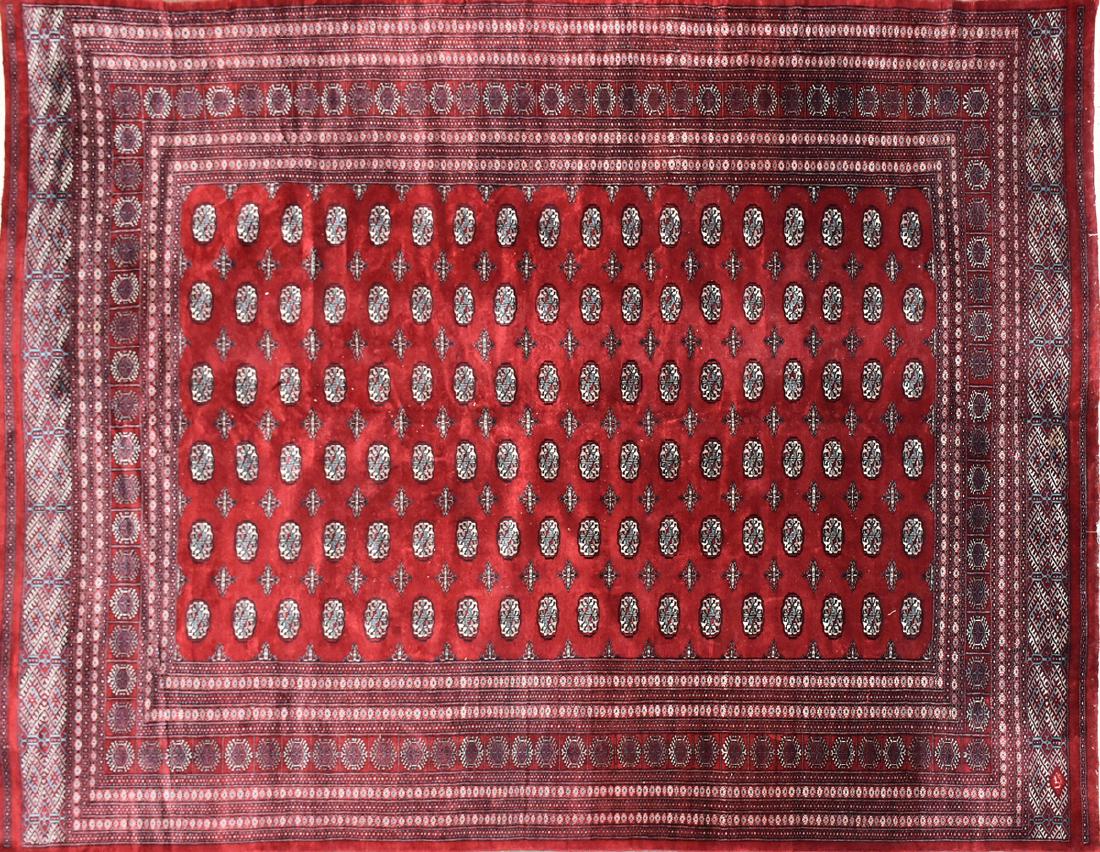 A PAKISTANI HAND KNOTTED WOOL BOKHARA PATTERN RUG, LATE (1 of 6)