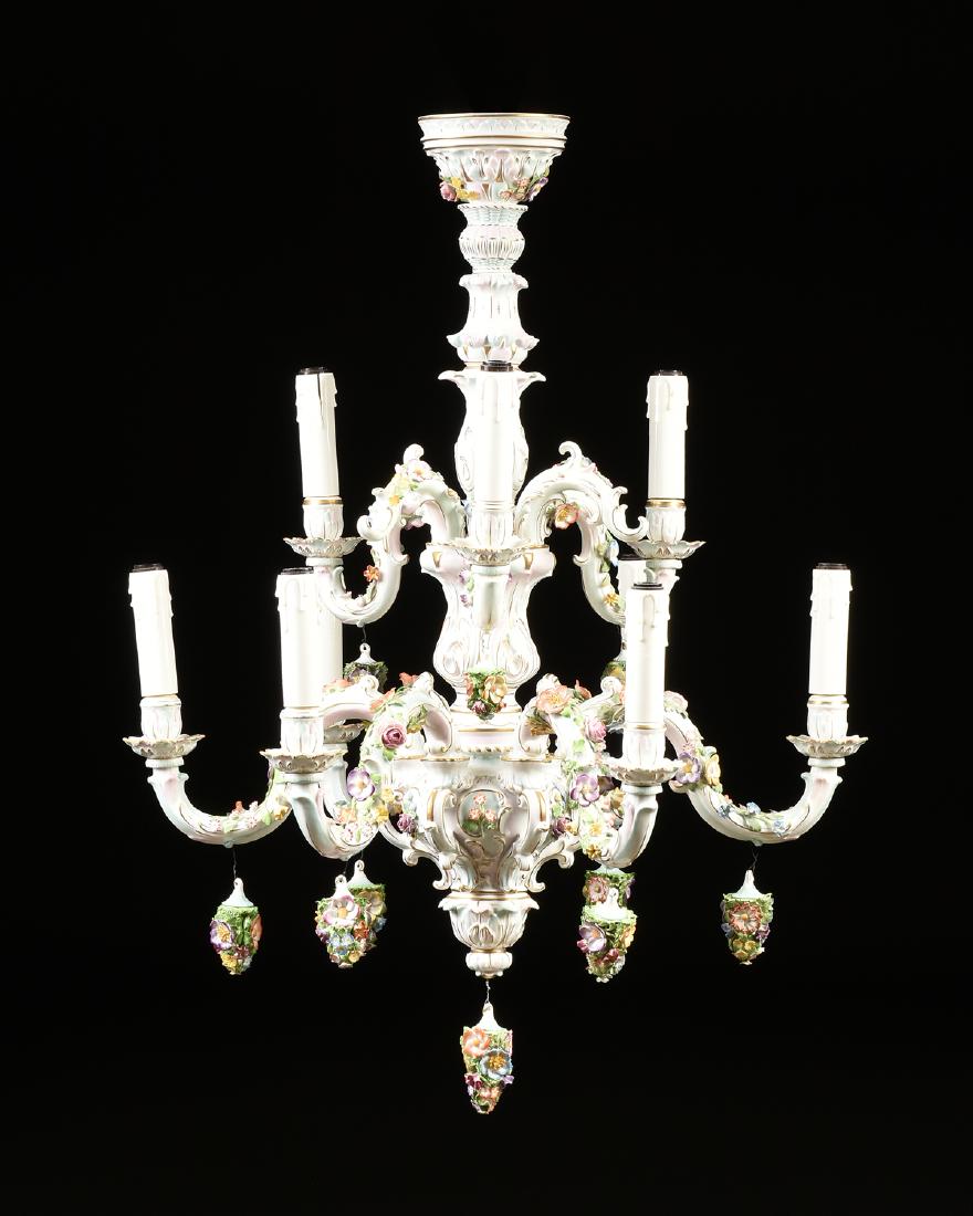 AN ALFRED VOIGT A.G. PORZELLANFABRIK NINE-LIGHT ROCOCO: AN ALFRED VOIGT A.G. PORZELLANFABRIK NINE-LIGHT ROCOCO STYLE GILT AND ENAMEL DECORATED PORCELAIN TWO-TIER CHANDELIER, SITZENDORF, GERMANY, CIRCA 1915-1925, with multipart molded porcelain acanthus lea