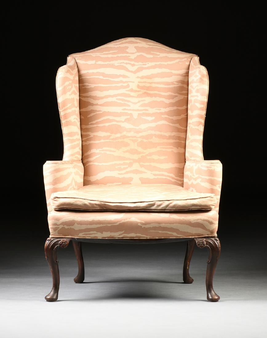 A QUEEN ANNE STYLE CARVED WALNUT WING CHAIR, CIRCA (1 of 5)