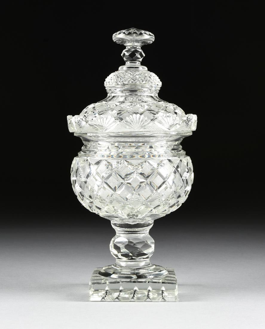 AN ANGLO-IRISH REGENCY PERIOD CUT CRYSTAL COVERED: AN ANGLO-IRISH REGENCY PERIOD CUT CRYSTAL COVERED COMPORT, CIRCA 1820-1830, of overall baluster form, the cover with radiating star cut handle with faceted knop over diamond cut and slice cut bands, t