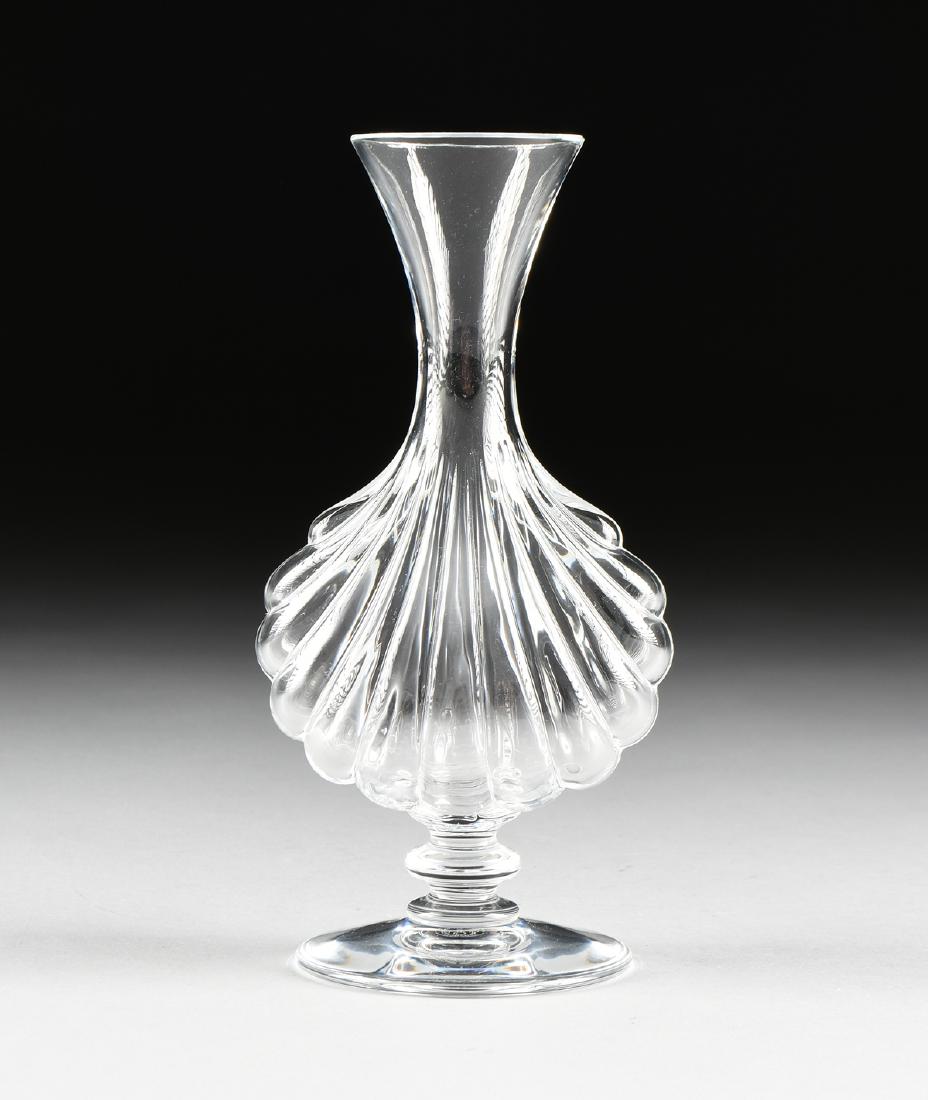A BACCARAT MOLDED CLEAR CRYSTAL FOOTED VASE IN THE (1 of 7)