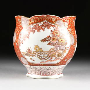 A JAPANESE RED AND GOLD IMARI PORCELAIN CACHEPOT,: A JAPANESE RED AND GOLD IMARI PORCELAIN CACHEPOT, ARITA, JAPAN, 20TH CENTURY, of baluster form with gilt scalloped rim, the body with three ogival shaped reserves with floral decoration in planters