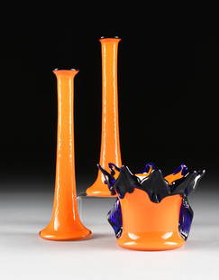 A GROUP OF THREE ANTON RUCKL CASED ART GLASS PIECES: A GROUP OF THREE ANTON RUCKL CASED ART GLASS PIECES WITH TRAILED DECORATION, NIZBOR, CZECHOSLOVAKIA (CZECH REPUBLIC), CIRCA 1960-1970, comprising a pair of trumpet form vases in orange glass cased in