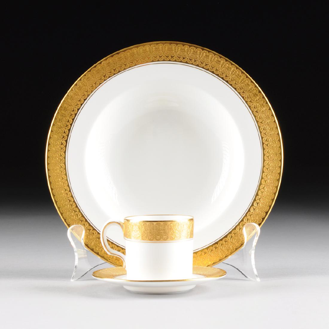 A THIRTY SIX PIECE ROYAL CROWN DERBY PARCEL GILT WHITE: A THIRTY SIX PIECE ROYAL CROWN DERBY PARCEL GILT WHITE GROUND DEMITASSE AND SOUP BOWL SET, ST. GEORGE PATTERN, OVERGLAZE RED AND IMPRESSED MARKS, 1931, each with traditional heavily gilt banded rim, r