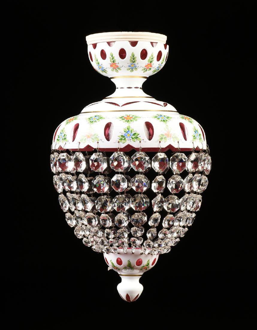 A BOHEMIAN ENAMELED CUT TO COLOR GLASS SINGLE LIGHT: A BOHEMIAN ENAMELED CUT TO COLOR GLASS SINGLE LIGHT LANTERN, MID 20TH CENTURY, opaque white glass with painted flower sprays alternating between cut to cranberry patterns, joined by twenty five gradua