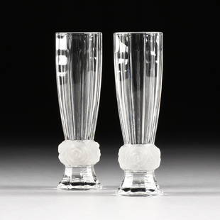 A PAIR OF PRESSED CLEAR CRYSTAL CHAMPAGNE FLUTES WITH: A PAIR OF PRESSED CLEAR CRYSTAL CHAMPAGNE FLUTES WITH FROSTED ROSE KNOPS, POSSIBLY FRENCH, LATE 20TH CENTURY, of flared multifaceted form, with frosted crystal roses with leaves. Height: 6 3/4" Diamet