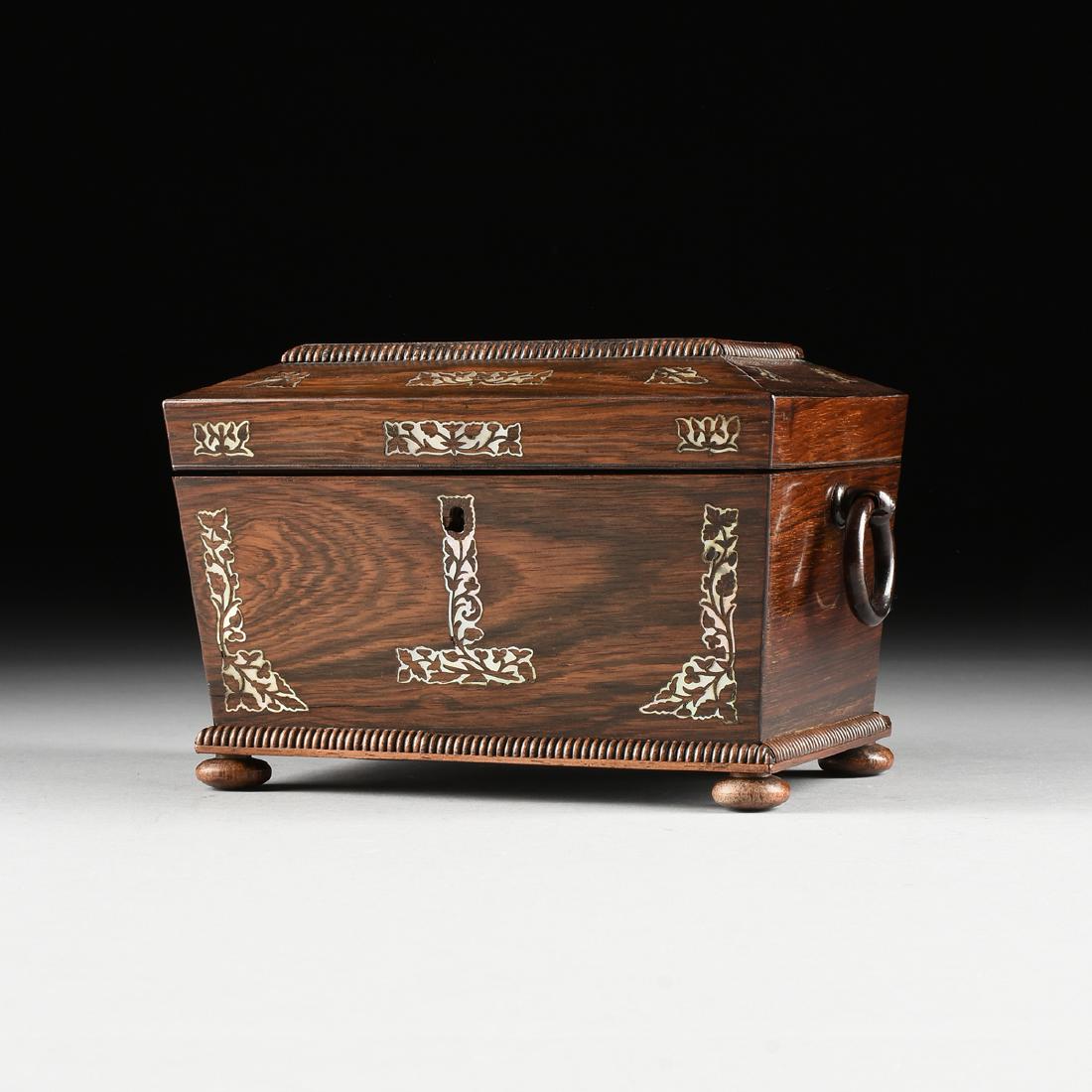 A SCOTTISH MOTHER-OF-PEARL INLAID ROSEWOOD SARCOPHAGUS: A SCOTTISH MOTHER-OF-PEARL INLAID ROSEWOOD SARCOPHAGUS FORM DOUBLE TEA CADDY, GLASGOW, 1860-1880, manufactured by J. Johnston & Co., the lidded top with raised carved gadroon edged plinth and angle ed