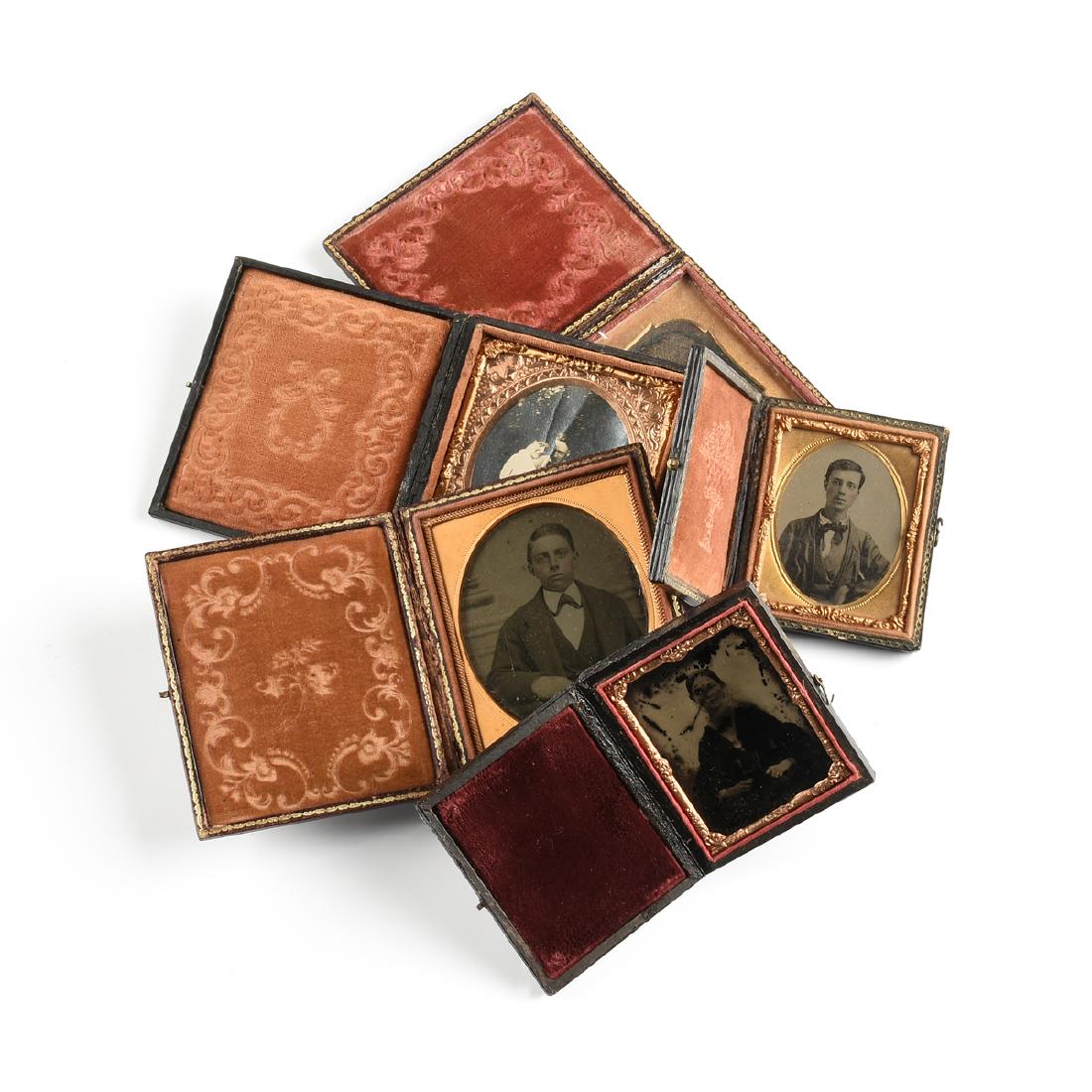 A GROUP OF FIVE EARLY PHOTOGRAPHIC PORTRAITS IN LEATHER (1 of 11)