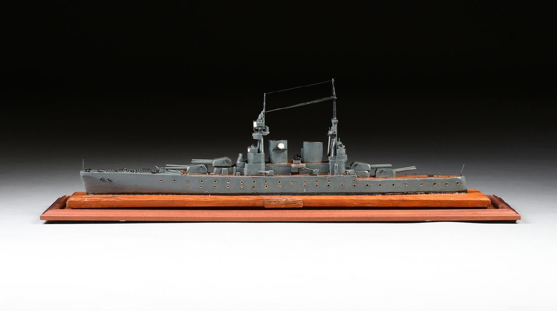 A WWII ERA HAND CARVED MODEL OF BRITISH BATTLESHIP HMS: A WWII ERA HAND CARVED MODEL OF BRITISH BATTLESHIP HMS HOOD, C. 1940, BY A GERMAN PRISONER OF WAR, PROBABLY TORONTO, CANADA, two towers stand over a loaded gun deck with nails used as aircraft guns an