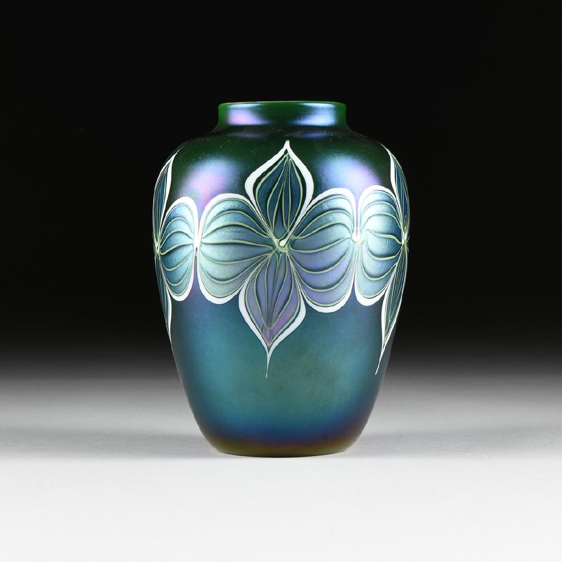 AN ORIENT & FLUME IRIDESCENT CASED ART GLASS VASE,: AN ORIENT & FLUME IRIDESCENT CASED ART GLASS VASE, CHICO, CALIFORNIA, 1982, of meiping form with short collared lip over broad shoulders and gently tapering body in iridescent purple/blue over dark gr