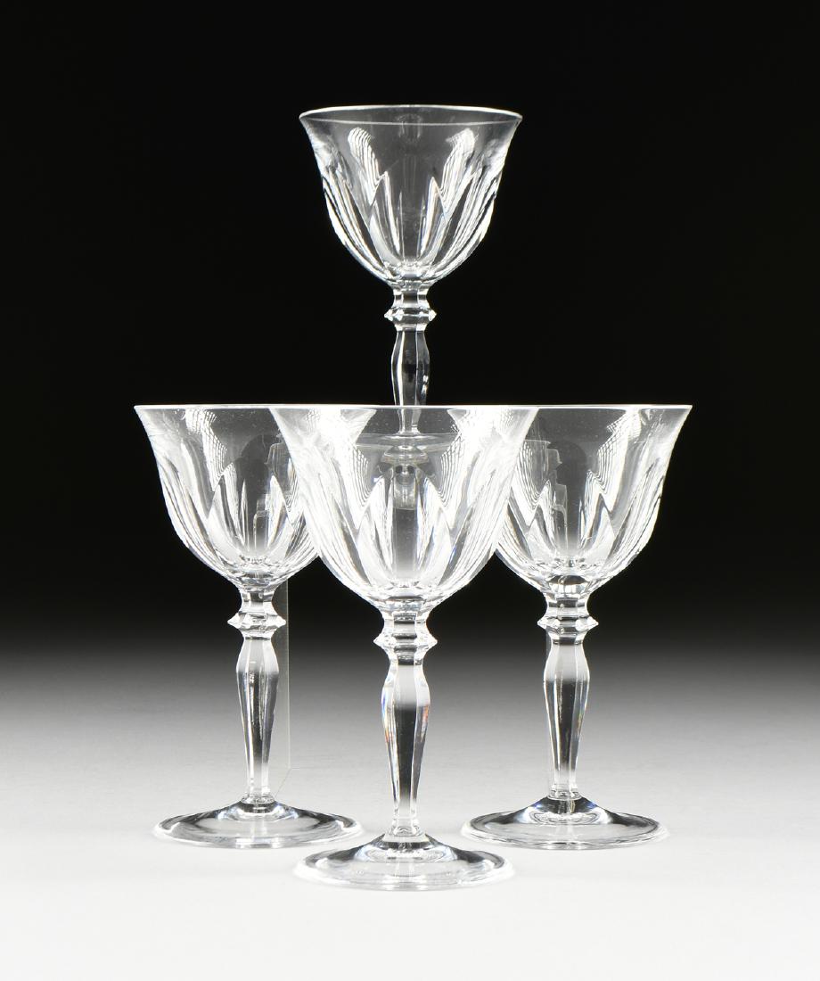 A SET OF FOUR PEILL & PUTZLER CUT CRYSTAL WINE GLASSES,: A SET OF FOUR PEILL & PUTZLER CUT CRYSTAL WINE GLASSES, RHEINLAND PATTERN, GERMAN, CIRCA 1960, each in the traditional Rheinland pattern and verso acid etched maker's mark, height: 6.25".