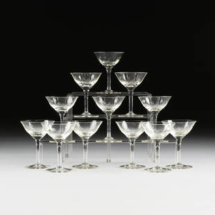 A SET OF TWELVE CANARY YELLOW DEPRESSION GLASS ETCHED: A SET OF TWELVE CANARY YELLOW DEPRESSION GLASS ETCHED COCKTAIL GLASSES, CIRCA 1940, the everted lip bell shape bowl raised on slightly waisted stem and spreading foot, with etched dot and line