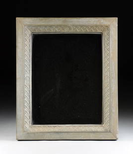 A MODERN PICKLED FINISH PRESSED METAL MIRROR,: A MODERN PICKLED FINISH PRESSED METAL MIRROR, of rectangular form and a beveled glass mirror, enclosed by a stylized cross caning patterned border and a conforming frame. Height: 34 5/8" Width: 28