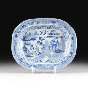 A VINTAGE BLUE AND WHITE TRANSFER DECORATED PLATTER,: A VINTAGE BLUE AND WHITE TRANSFER DECORATED PLATTER, after WEDGWOOD, "WILLOW" PATTERN, 20TH CENTURY, of rectangular form with rounded corners, pale blue and dark cobalt transfer decoration featuring