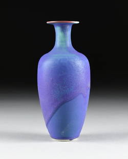 AN AMERICAN STUDIO POTTERY GLAZED PORCELAIN VASE, CIRCA: AN AMERICAN STUDIO POTTERY GLAZED PORCELAIN VASE, CIRCA 1970-1980, the baluster form vase with flared flat rim with cobalt blue glaze, unidentified mark. Height: 8 7/8" Diameter: 3 1/2"