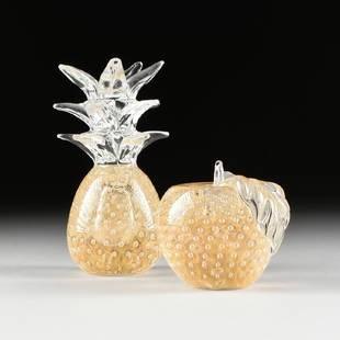 TWO CONTEMPORARY ITALIAN ART GLASS MODELS OF FRUIT, BY: TWO CONTEMPORARY ITALIAN ART GLASS MODELS OF FRUIT, BY VILCA, comprising an apple and a pineapple, each naturalistically modeled with internal bubbles within gilt speckled shadows, underside centering