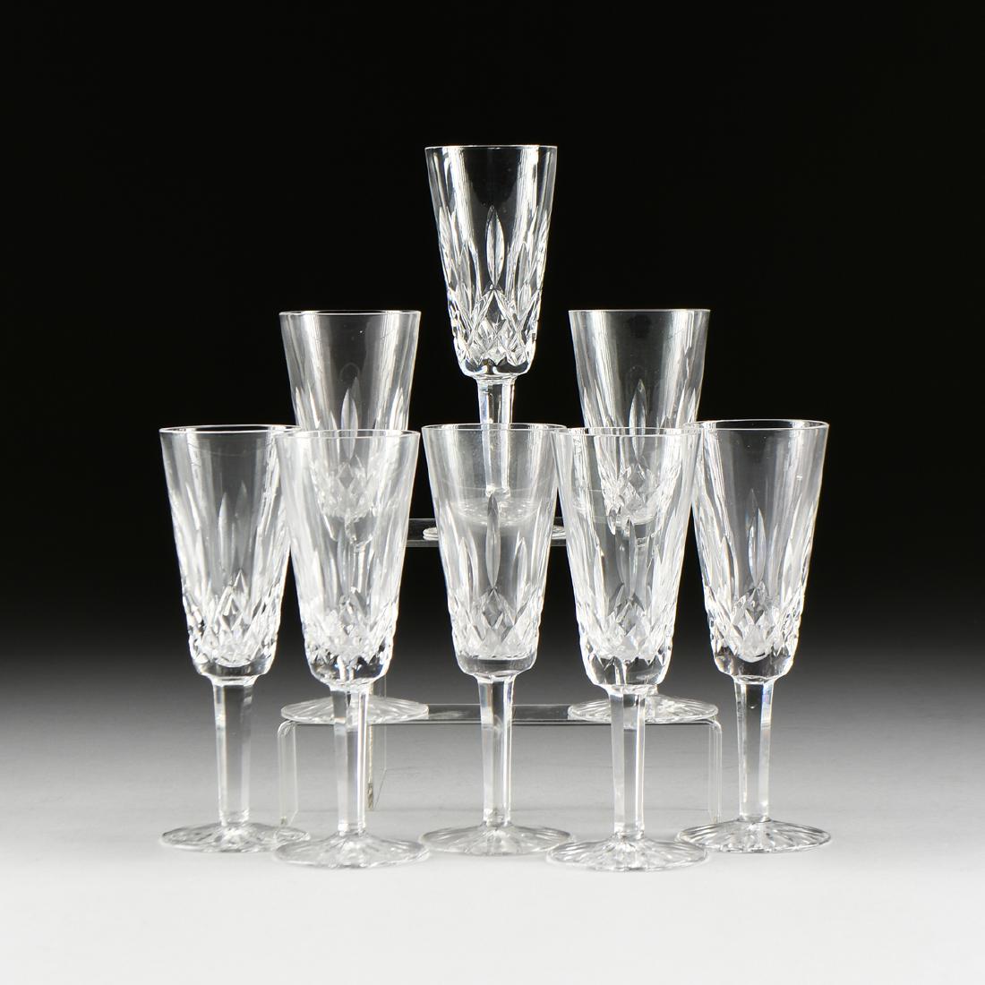 A SET OF EIGHT CUT CRYSTAL CHAMPAGNE FLUTES, "LISMORE" (1 of 4)
