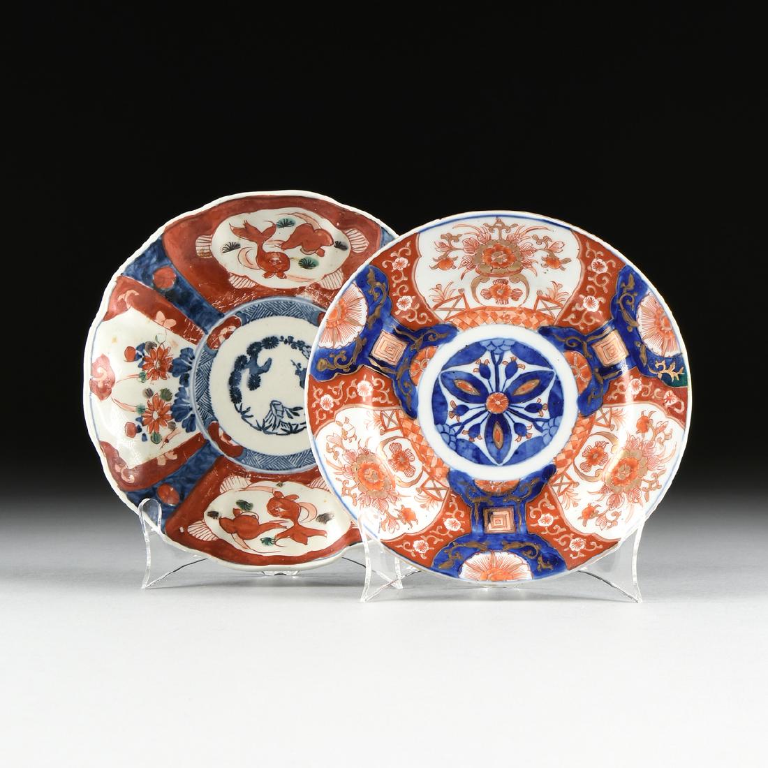 A NEAR PAIR OF JAPANESE EXPORT ENAMELED PORCELAIN IMARI: A NEAR PAIR OF JAPANESE EXPORT ENAMELED PORCELAIN IMARI PLATES, LATE MEIJI PERIOD (1868-1912), the floriform plate centering a "Three Friend's of Winter," medallion within reserves painted with goldfi