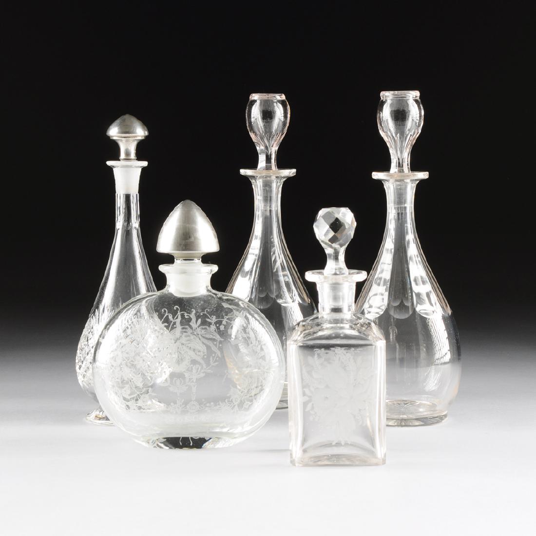 A GROUP OF FIVE CLEAR CRYSTAL DECANTERS, LATE (1 of 7)