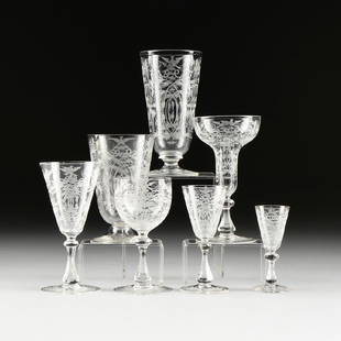 A SEVENTY SIX PIECE LOBMEYR STYLE ETCHED GLASS STEMWARE: A SEVENTY SIX PIECE LOBMEYR STYLE ETCHED GLASS STEMWARE SET, AUSTRIA/BOHEMIA, LATE 19TH/EARLY 20TH CENTURY, each piece with etched spread winged birds above bar and beaded swags connecting crossed lea