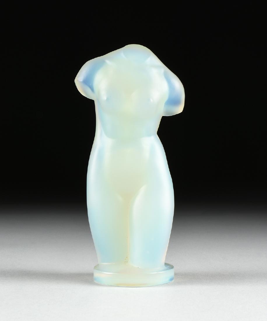 A SABINO SCULPTURE, "FEMME PARFAITE," PARIS, CIRCA: A SABINO SCULPTURE, "FEMME PARFAITE," PARIS, CIRCA 1928, opalescent molded glass, the nude female torso in contrapposto on a circular base, signed "Sabino, Paris," and retaining original gilt foil lab