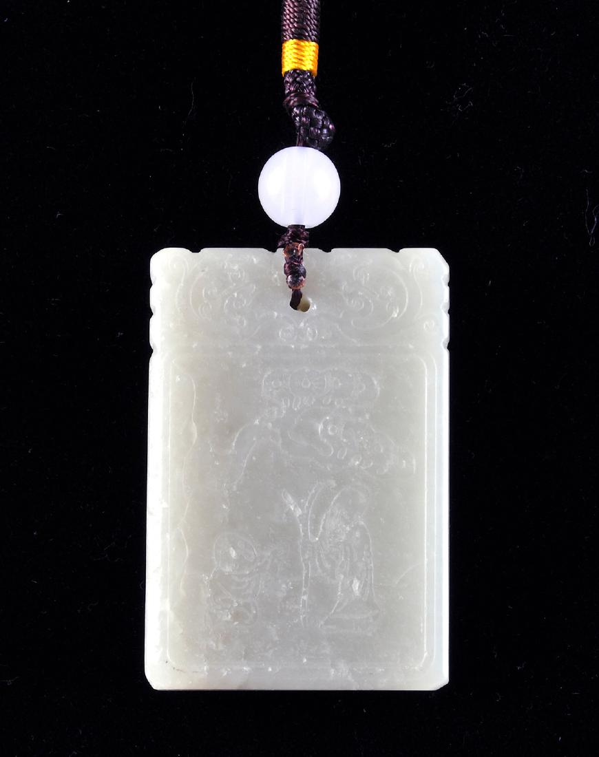 A CHINESE CARVED CELADON JADE PENDANT, (1 of 2)
