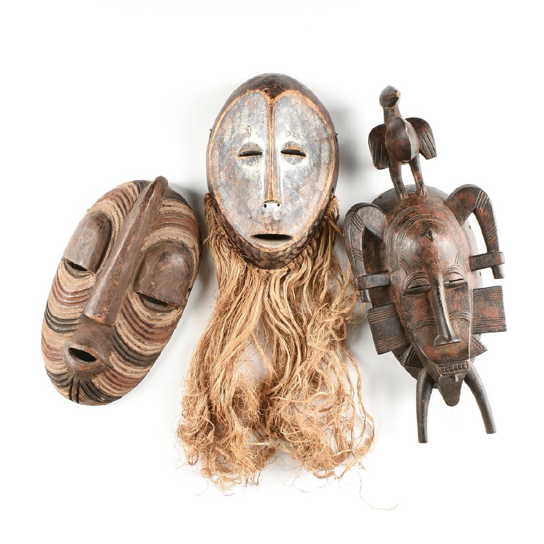 A GROUP OF THREE AFRICAN MASKS, 20TH CENTURY, (1 of 17)