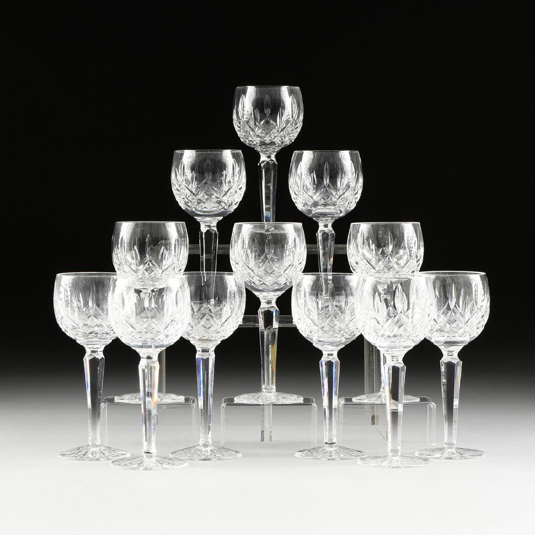 A SET OF TWELVE WATERFORD CUT CRYSTAL BALLOON WINE: A SET OF TWELVE WATERFORD CUT CRYSTAL BALLOON WINE GLASSES, LISMORE PATTERN, ACID ETCHED MARK, MODERN, each marked on underside, height: 7.50".