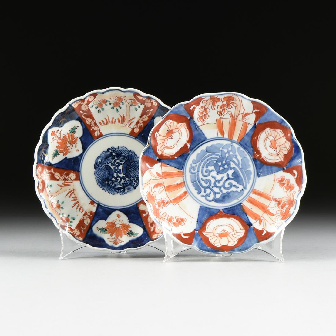 A NEAR PAIR OF JAPANESE EXPORT ENAMELED PORCELAIN IMARI: A NEAR PAIR OF JAPANESE EXPORT ENAMELED PORCELAIN IMARI PLATES, LATE MEIJI PERIOD (1868-1912), the floriform edges centering foliate medallions. Diameter: 8 1/2"