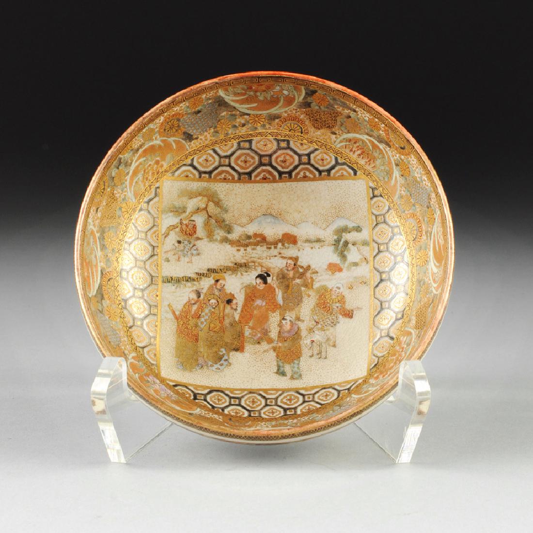 A DIMINUTIVE SATSUMA PARCEL GILT AND ENAMELED BOWL,: A DIMINUTIVE SATSUMA PARCEL GILT AND ENAMELED BOWL, MEIJI PERIOD, the interior elaborately painted and parcel gilt with immortals and their attributes by a meandering mountainous hillside stream enclo