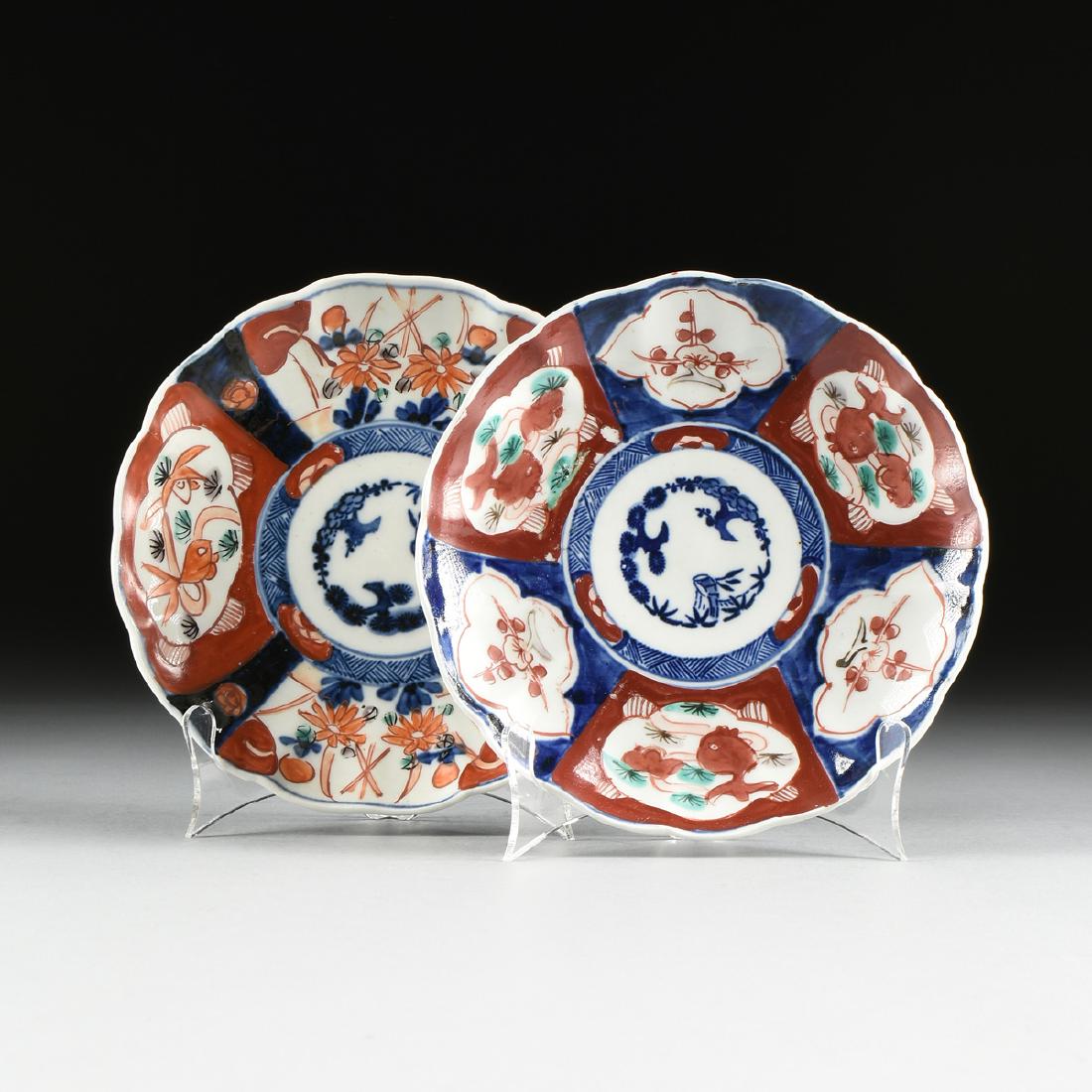 A NEAR PAIR OF JAPANESE EXPORT ENAMELED PORCELAIN IMARI: A NEAR PAIR OF JAPANESE EXPORT ENAMELED PORCELAIN IMARI PLATES, LATE MEIJI PERIOD (1868-1912), the floriform edges centering a "Three Friends of Winter," medallion within reserves painted respectively