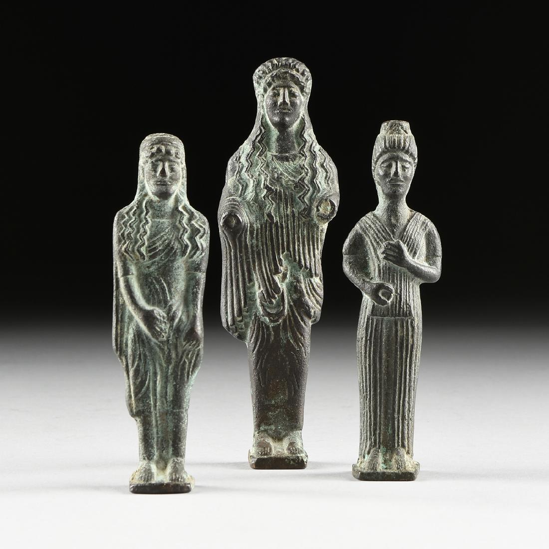 A GROUP OF THREE GREEK ARCHAIC STYLE BRONZE VOTIVE (1 of 10)