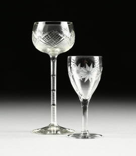 A GROUP OF TWO GLASS WINE STEMS, AMERICAN, 20TH: A GROUP OF TWO GLASS WINE STEMS, AMERICAN, 20TH CENTURY, comprising an ovoid form bowl cut with fans and panels of crosshatching, raised on a hexagonal stem with notched cut edges and a plain spread