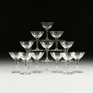 A SET OF TWELVE CANARY YELLOW DEPRESSION GLASS ETCHED: A SET OF TWELVE CANARY YELLOW DEPRESSION GLASS ETCHED COCKTAIL GLASSES, CIRCA 1940, the everted lip bell shape bowl raised on slightly waisted stem and spreading foot, with etched dot and line