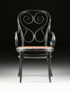 attributed to GEBRUDER THONET, AN EBONIZED BENTWOOD: attributed to GEBRUDER THONET, AN EBONIZED BENTWOOD ARMCHAIR, POSSIBLY VIENNESE, CIRCA 1886, the hoop back centering a scrolled heart above whip scrolls, above a curved integral woven cane seat,