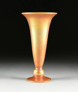 AN AMERICAN ART GLASS IRIDESCENT GOLD TRUMPET VASE,: AN AMERICAN ART GLASS IRIDESCENT GOLD TRUMPET VASE, LUNDBERG STUDIOS, CALIFORNIA, 1995, the dore golden and orange hue vase with flared rim, ball socle and circular tapered foot, verso engraved,