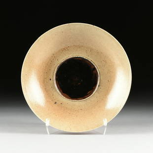 attributed CLEMENTINA VAN DER WALT (South African b.: attributed CLEMENTINA VAN DER WALT (South African b. 1952) A GLAZED PORCELAIN SERVING PLATE, CAPE TOWN, SOUTH AFRICA, the wheel thrown circular plate with tan/gold speckled glaze along the rim and