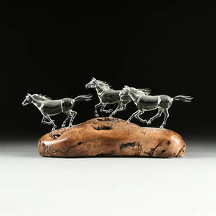 WARREN HOOPER (American 20th Century) A GLASS HORSE AND: WARREN HOOPER (American 20th Century) A GLASS HORSE AND BURLED WALNUT SCULPTURE, "STAMPEDE," modeled as three galloping transparent glass horses on a natural burled walnut base, gold ink signature