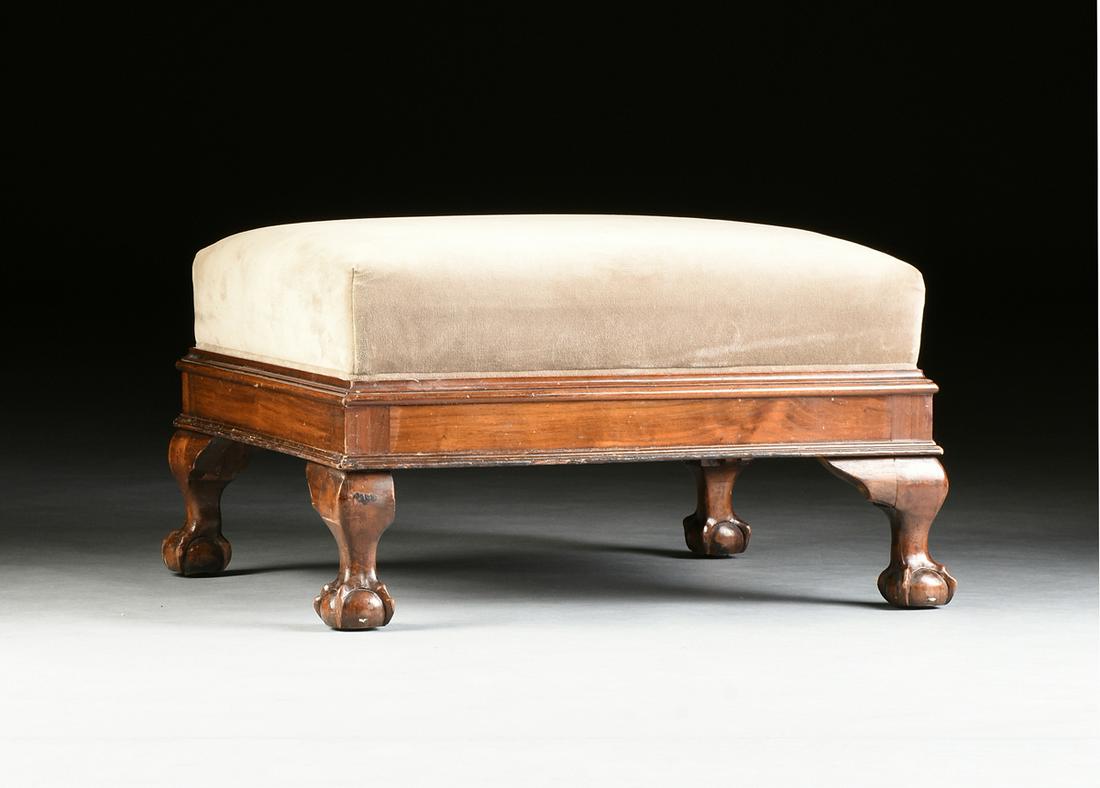 AN AMERICAN CLASSICAL MAHOGANY FOOTSTOOL, after THOMAS: AN AMERICAN CLASSICAL MAHOGANY FOOTSTOOL, after THOMAS CHIPPENDALE (1718-1779), CIRCA 1830, the rectangular, gray velvet upholstered cushion fitted within a molded edge, above a wide, flat skirt, rais